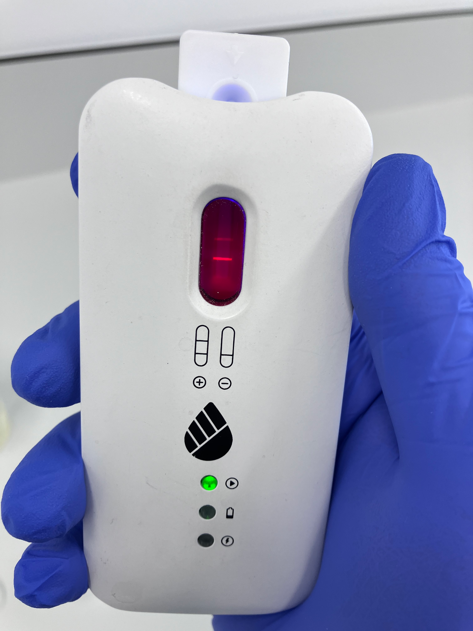 A lateral flow cassette and compact reader during Radetec assay development